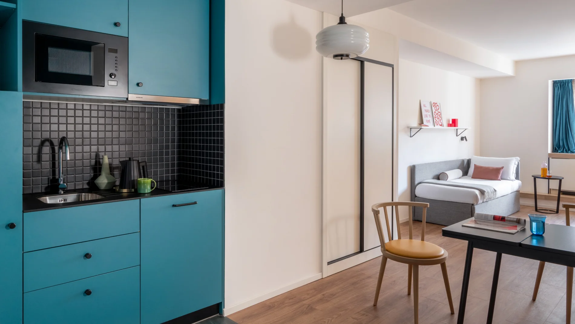 Turquoise kitchenette with microwave, sink and living area ideal for extended stays - Aparthotel Colombo, BZAR hotels in Rome