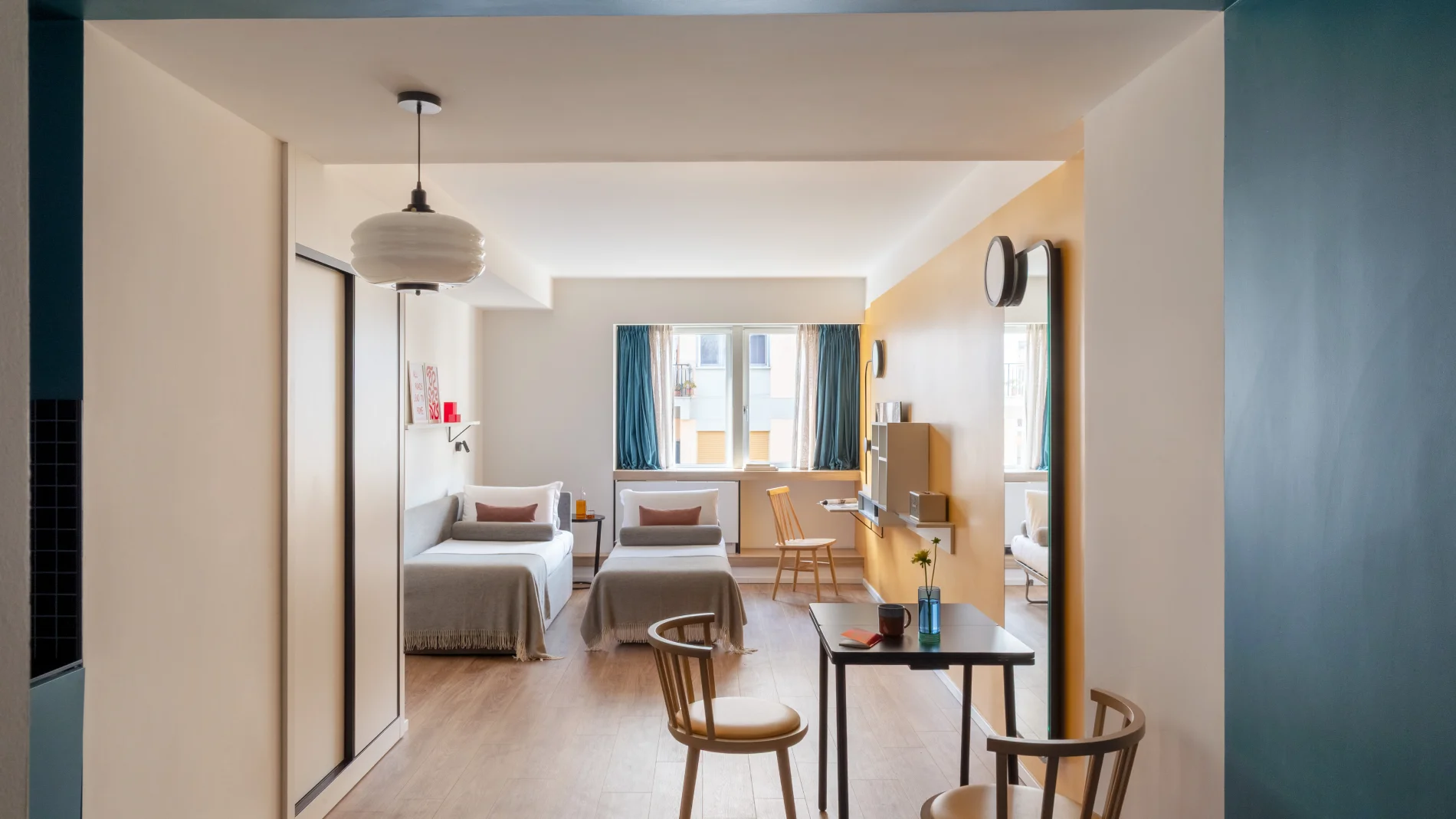Spacious suite with twin beds, living area, desk and contemporary yellow-blue accents - Aparthotel Colombo, BZAR hotels in Rome