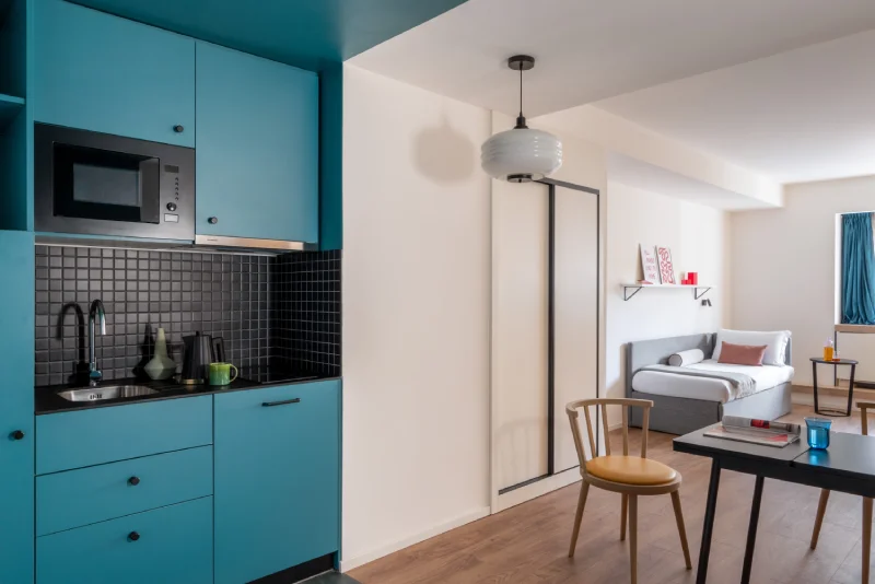 Apartment with equipped kitchenette, modern living area, dining table and single bed - Aparthotel Colombo, BZAR hotels in Rome